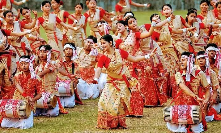 Bihu dancers in traditional Assamese silk