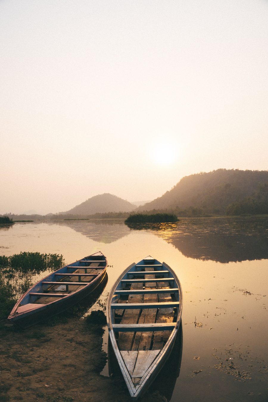 Boats on the Brahmaputra river at sunset